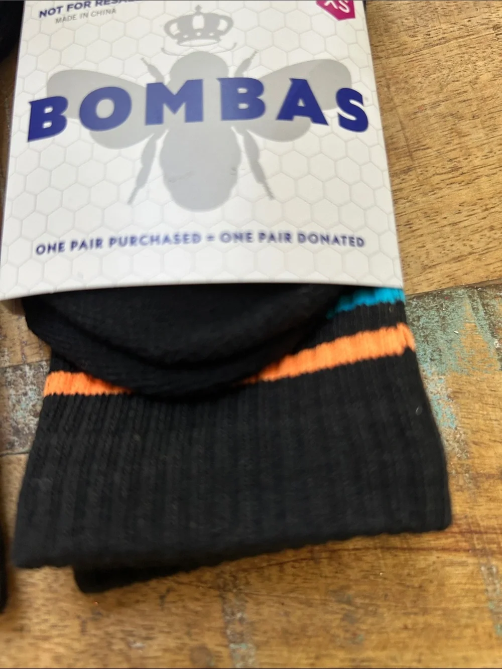 Bombas Black Crew Socks with Orange, Blue, and Yellow Accents for Children